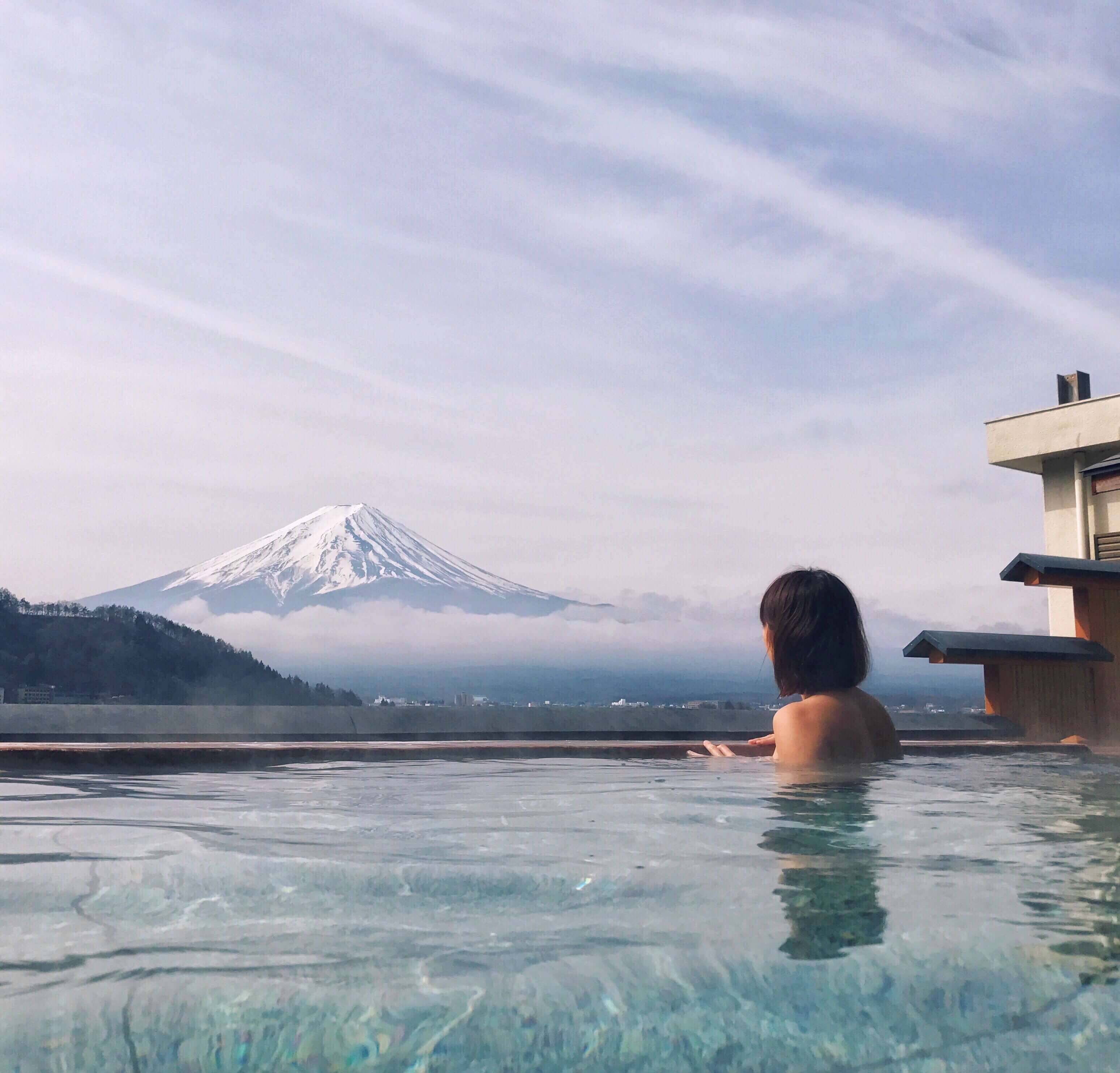 Hot spring with Mount Fuji in the distance, Japan